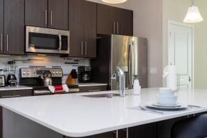 a kitchen with a white counter top and stainless steel appliances at Breathtaking Vacation Home with Private Hot Tube 168 in Davenport