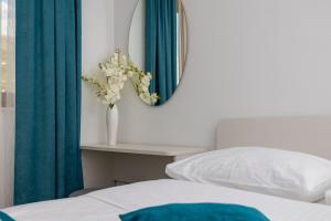 Postel nebo postele na pokoji v ubytování Apartments Lea