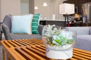 a vase filled with plants on a coffee table at Breathtaking Vacation Home with Private Hot Tube 168 in Davenport