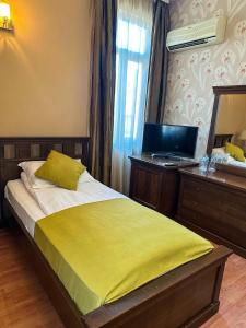 Postel nebo postele na pokoji v ubytování Vidin Hotel