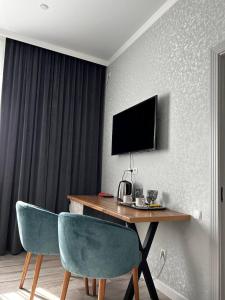 TV a/nebo společenská místnost v ubytování JETISY COMPLEX
