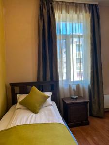 Postel nebo postele na pokoji v ubytování Vidin Hotel