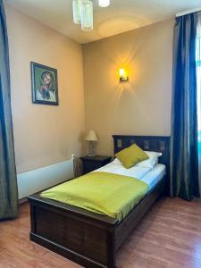 Postel nebo postele na pokoji v ubytování Vidin Hotel