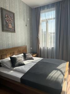 Postel nebo postele na pokoji v ubytování Vidin Hotel