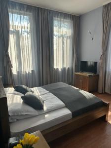Postel nebo postele na pokoji v ubytování Vidin Hotel