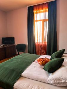 Postel nebo postele na pokoji v ubytování Vidin Hotel