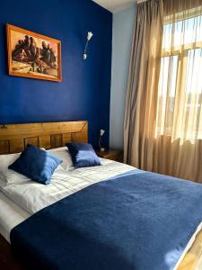 Postel nebo postele na pokoji v ubytování Vidin Hotel