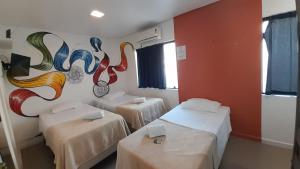 Postel nebo postele na pokoji v ubytování Anhembi Hostel