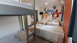 Postel nebo postele na pokoji v ubytování Anhembi Hostel