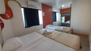 Postel nebo postele na pokoji v ubytování Anhembi Hostel
