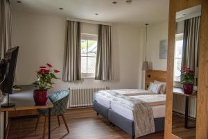 Postel nebo postele na pokoji v ubytování Seehotel Schlick