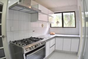 Kuchyň nebo kuchyňský kout v ubytování Oasis Urbano
