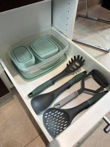 a drawer full of utensils in a cabinet at Estepa Apart 1B calidad y confort in Comodoro Rivadavia