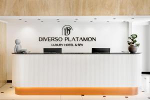 a sign for the dyescho plantation lobby hotel and spa at Diverso Platamon, Luxury Hotel & Spa in Platamonas