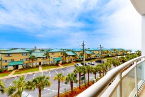 a view of a street with palm trees and buildings at Destin West Gulfside Villa V402 in Fort Walton Beach