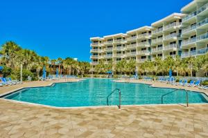 a swimming pool in front of a resort at Destin West Gulfside Villa V402 in Fort Walton Beach