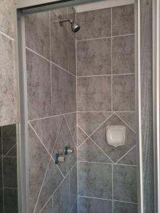 a bathroom with a shower with a toilet at Home away from Home in Pretoria
