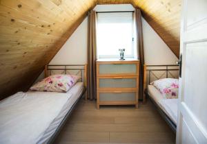 Postel nebo postele na pokoji v ubytování Domki u Goni