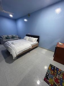 Postel nebo postele na pokoji v ubytování Yan Inn