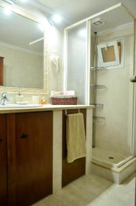 a bathroom with a sink and a shower at Antalia Home in Kalamata
