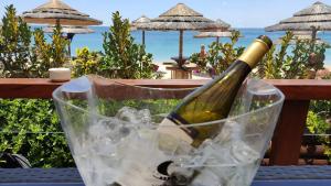 a bottle of wine in an ice bucket on a table at Casa Jasmim in Azeitao
