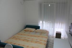 Ένα ή περισσότερα κρεβάτια σε δωμάτιο στο Jelena apartment Bar