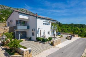 a villa with a view of the house at Apartmani Jadranka in Starigrad-Paklenica