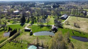 an aerial view of a park with two ponds at Mežvītoli in Mercendarbe