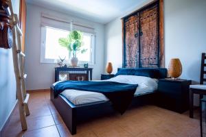 Postel nebo postele na pokoji v ubytování Casa Loto