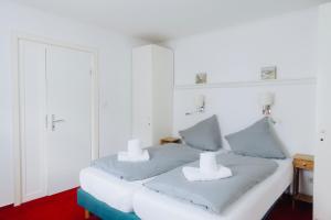 Postel nebo postele na pokoji v ubytování Hotel Garni Zur Linde