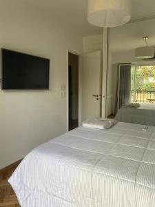 Ένα ή περισσότερα κρεβάτια σε δωμάτιο στο 3 de Febrero SUITES 2 dormitorios