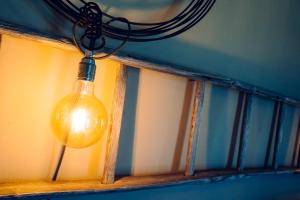 a light bulb hanging from a window at Agriturismo Sweet Cottage in Marina di Grosseto