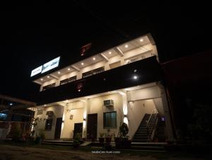 a building with lights on it at night at Ratna Hotel & Banquet in Muzaffarpur
