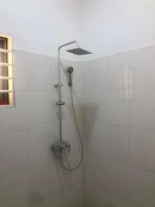 a shower with a shower head in a bathroom at nanas@TEMA C11 in Tema