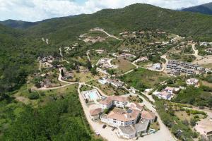 an aerial view of a small village in the mountains at Hotel Les Pavillons Du Golfe in Favone