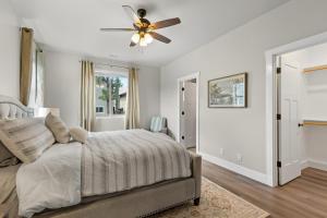 a bedroom with a bed and a ceiling fan at Serene Escape - Close to Sedona and Grand Canyon in Flagstaff