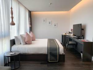 Ένα ή περισσότερα κρεβάτια σε δωμάτιο στο SOOKNIRUND HOTEL