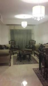 a living room with couches and a coffee table at شقه مفروشه سوبر ديلوكس in Amman