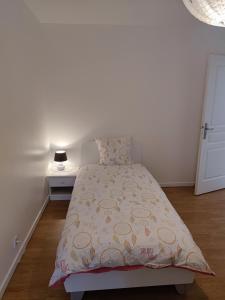 a bedroom with a bed with a yellow bedspread at Au Grand Bonheur - Gîte Padirac - Rocamadour in Miers +47 photos