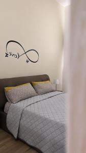 Postel nebo postele na pokoji v ubytování B&B Piano Romano -con parcheggio privato gratuito-