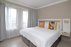 Krevet ili kreveti u jedinici u okviru objekta White Orchid Luxury Apartment