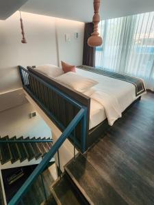 Ένα ή περισσότερα κρεβάτια σε δωμάτιο στο SOOKNIRUND HOTEL
