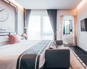 Ένα ή περισσότερα κρεβάτια σε δωμάτιο στο SOOKNIRUND HOTEL