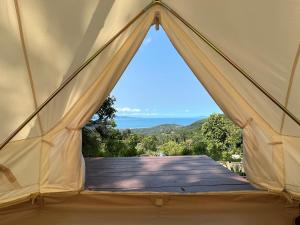 a view from the inside of a tent with a window at The Hidden Gem in Ban Nok