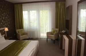 Postel nebo postele na pokoji v ubytování Hotel Európa Gunaras