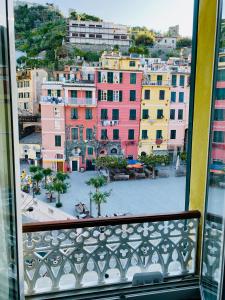 a view of a city from a window at La Marina Vernazza Appartamento Piazza Marconi in Vernazza