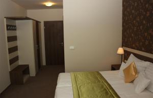 Postel nebo postele na pokoji v ubytování Hotel Európa Gunaras
