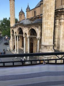 a large stone building with a gate in front of it at ESER PALAS OTELİ in Konya