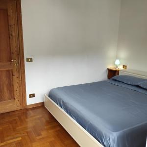 Postel nebo postele na pokoji v ubytování Casa San Valentino Dolomiti Val di Zoldo