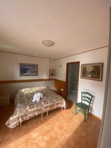a bedroom with a bed with a stuffed animal on it at Alloggio Agrituristico Ronchi Di Fornalis in Cividale del Friuli